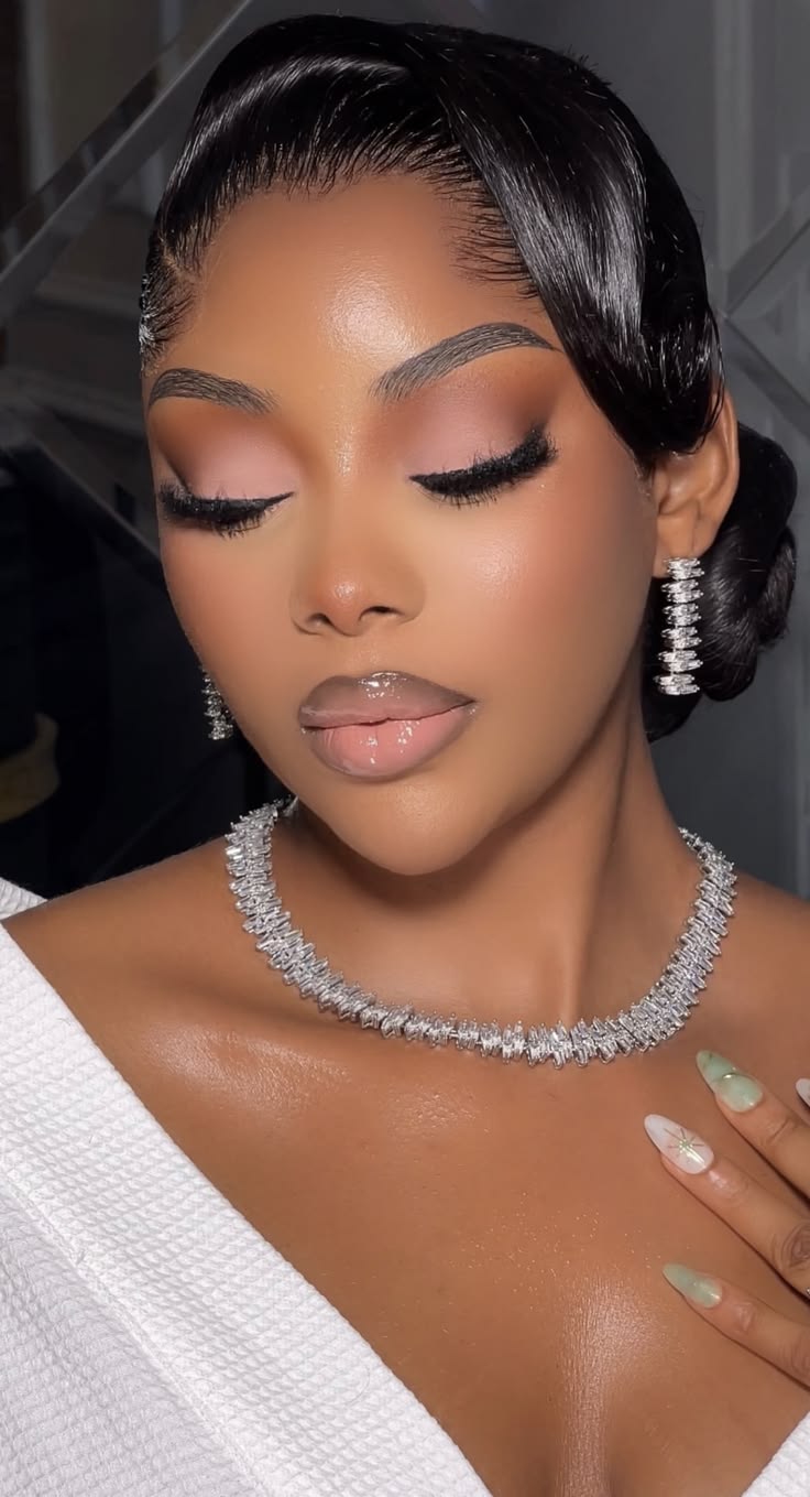 Soft glam with pink eyeshadow, sleek waves and a diamond necklace